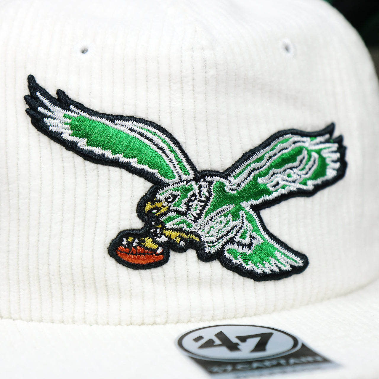 The Throwback eagles logo on the Throwback Philadelphia Eagles Corduroy Snapback Hat | White Corduroy Snap Cap