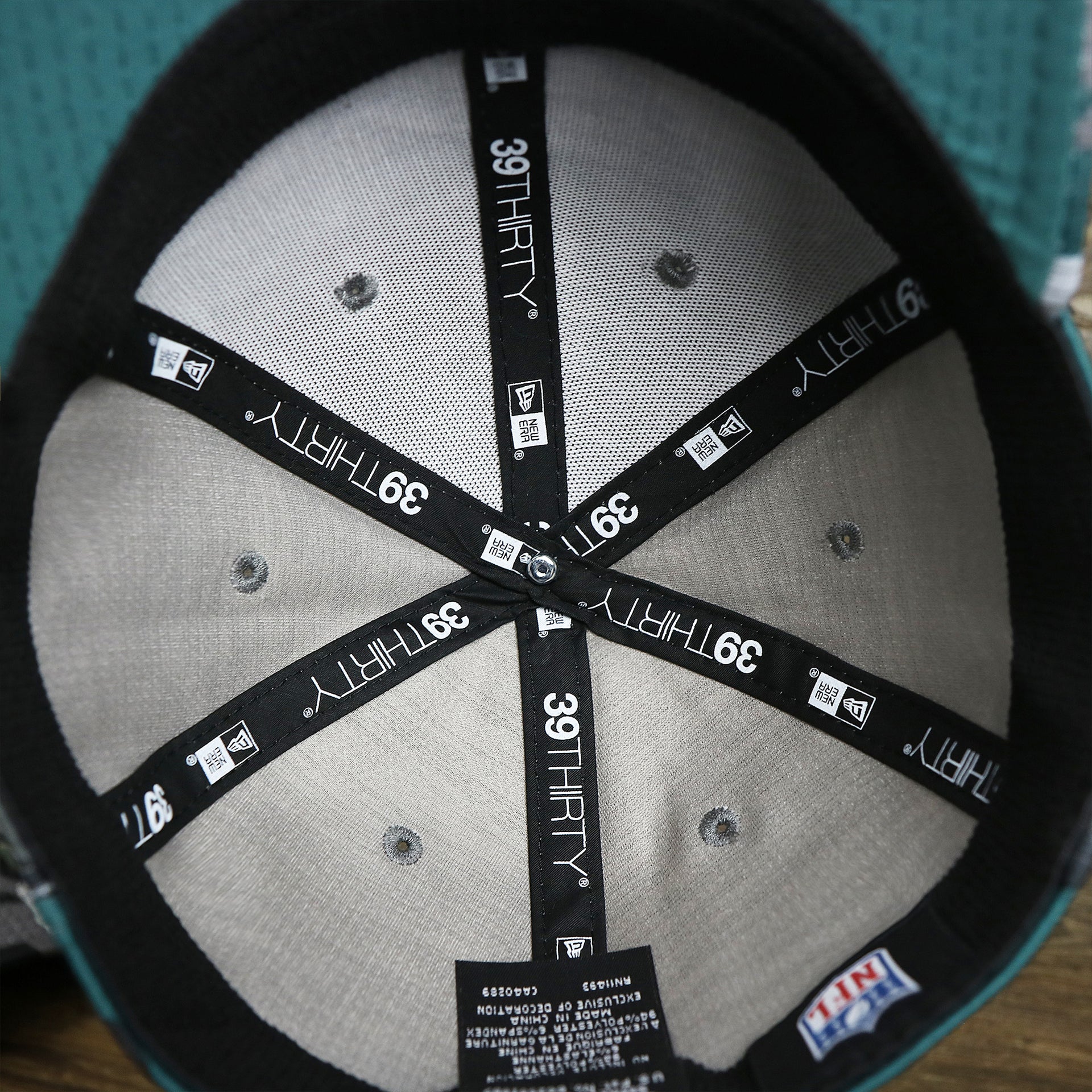 The inside of the Philadelphia Eagles Summer Training 2022 Camo 39Thirty FlexFit Cap | Midnight Green Camo 39Thirty Cap