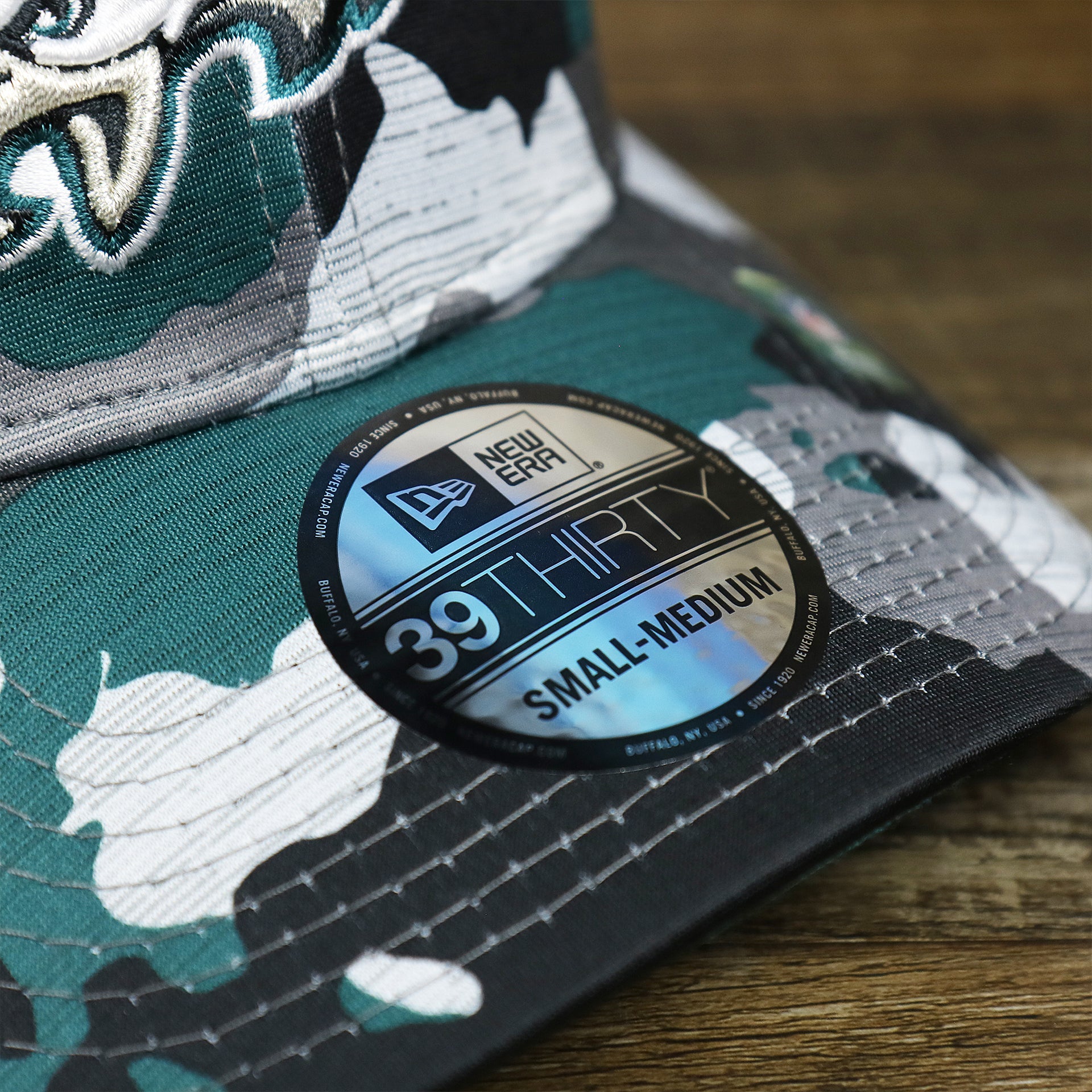 The 39Thirty Sticker on the Philadelphia Eagles Summer Training 2022 Camo 39Thirty FlexFit Cap | Midnight Green Camo 39Thirty Cap