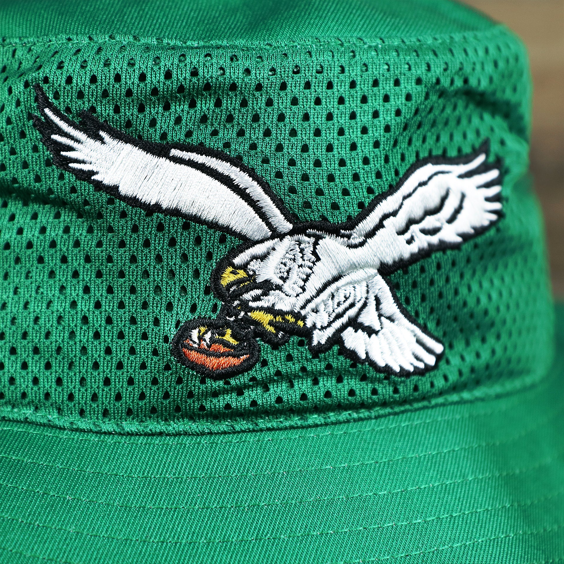 The Throwback Eagles Logo on the Throwback Philadelphia Eagles 1987 White Eagles Logo Panama Pail Bucket Hat | Kelly Green Bucket Hat