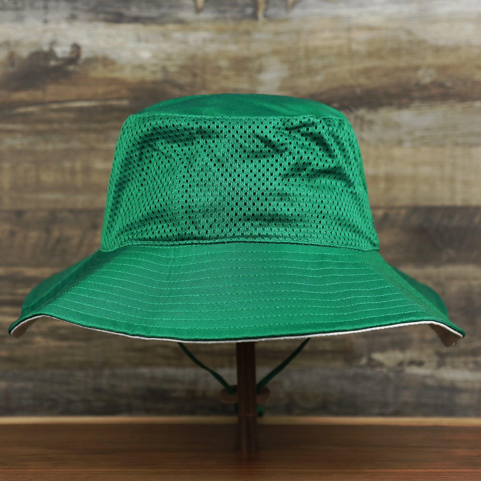 The backside of the Throwback Philadelphia Eagles 1987 White Eagles Logo Panama Pail Bucket Hat | Kelly Green Bucket Hat