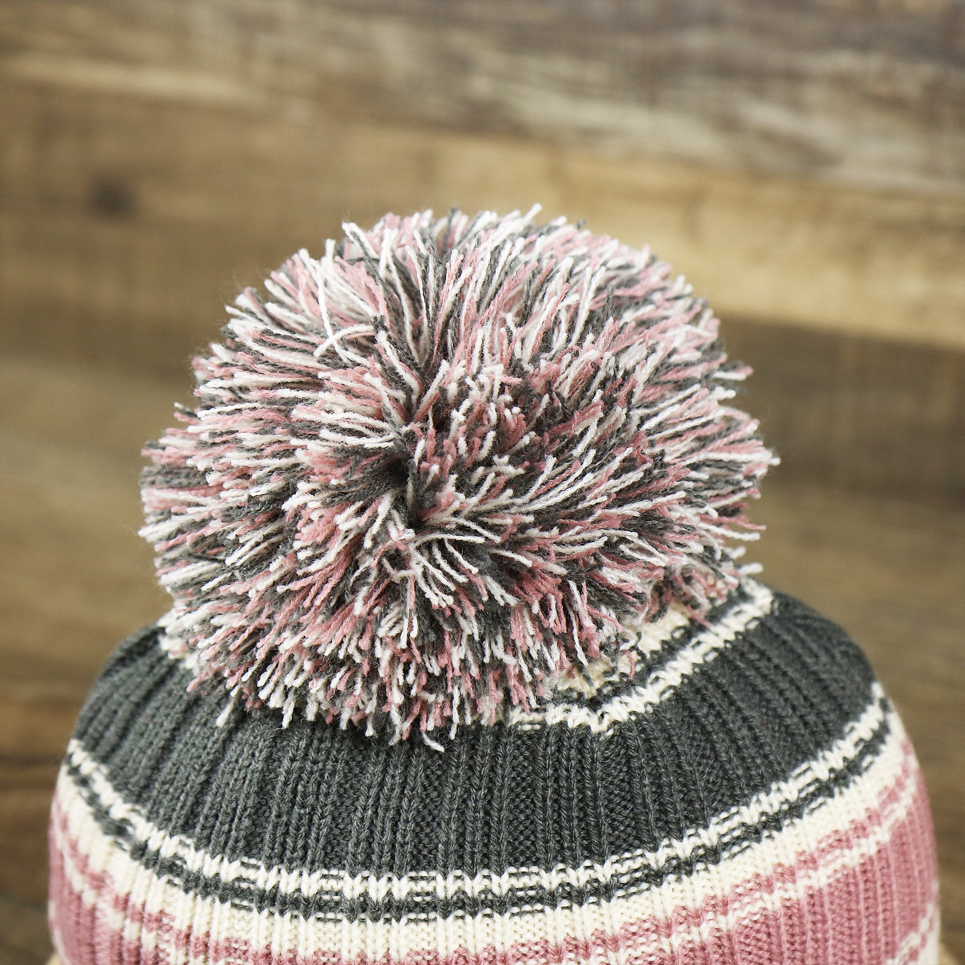 The Pom Pom on the Women’s Philadelphia Eagles Black And White Eagles Logo Pom Pom Beanie | Women’s Natural Beanie