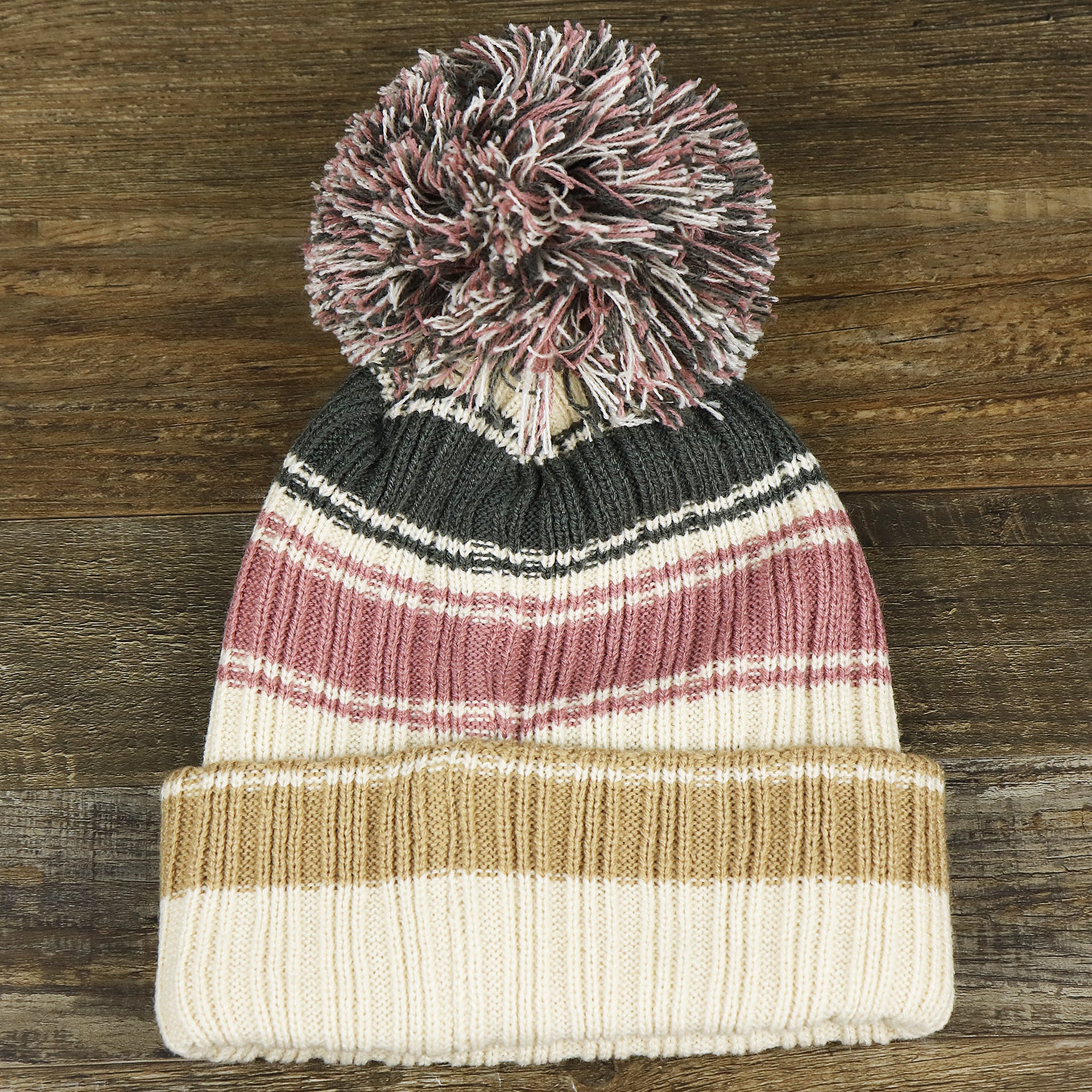 The backside of the Women’s Philadelphia Eagles Black And White Eagles Logo Pom Pom Beanie | Women’s Natural Beanie