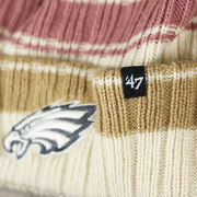 The 47 Brand Tag on the Women’s Philadelphia Eagles Black And White Eagles Logo Pom Pom Beanie | Women’s Natural Beanie