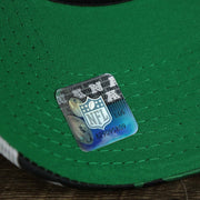 The NFL Sticker on the Throwback Philadelphia Eagles OnField NFL Summer Training 2022 39Thirty Camo FlexFit Cap | New Era Kelly Green