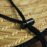 The black adjustable strap on the Philadelphia Eagles On Field 2022 Summer Training Straw Hat | New Era OSFM