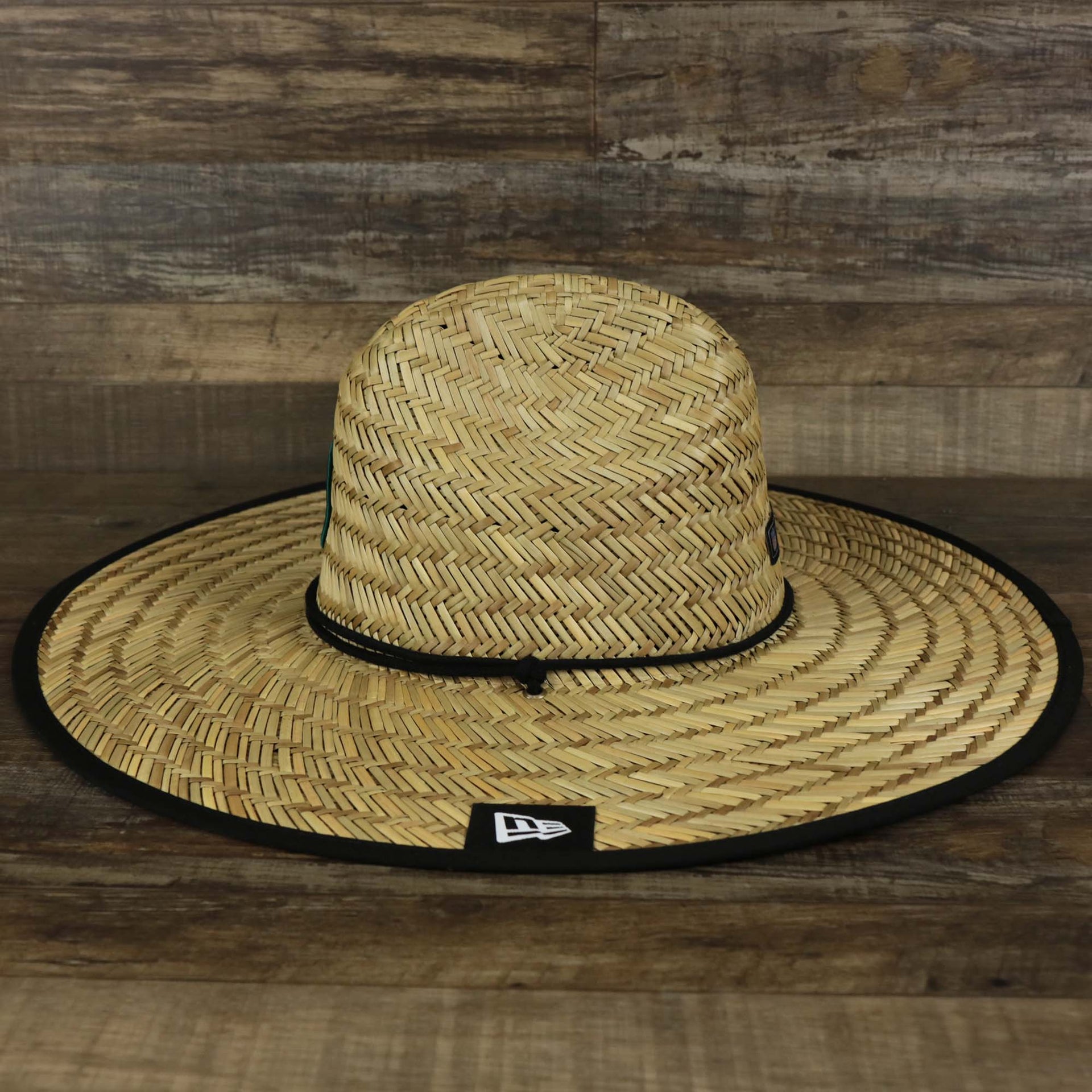 The wearer's left on the Philadelphia Eagles On Field 2022 Summer Training Straw Hat | New Era OSFM