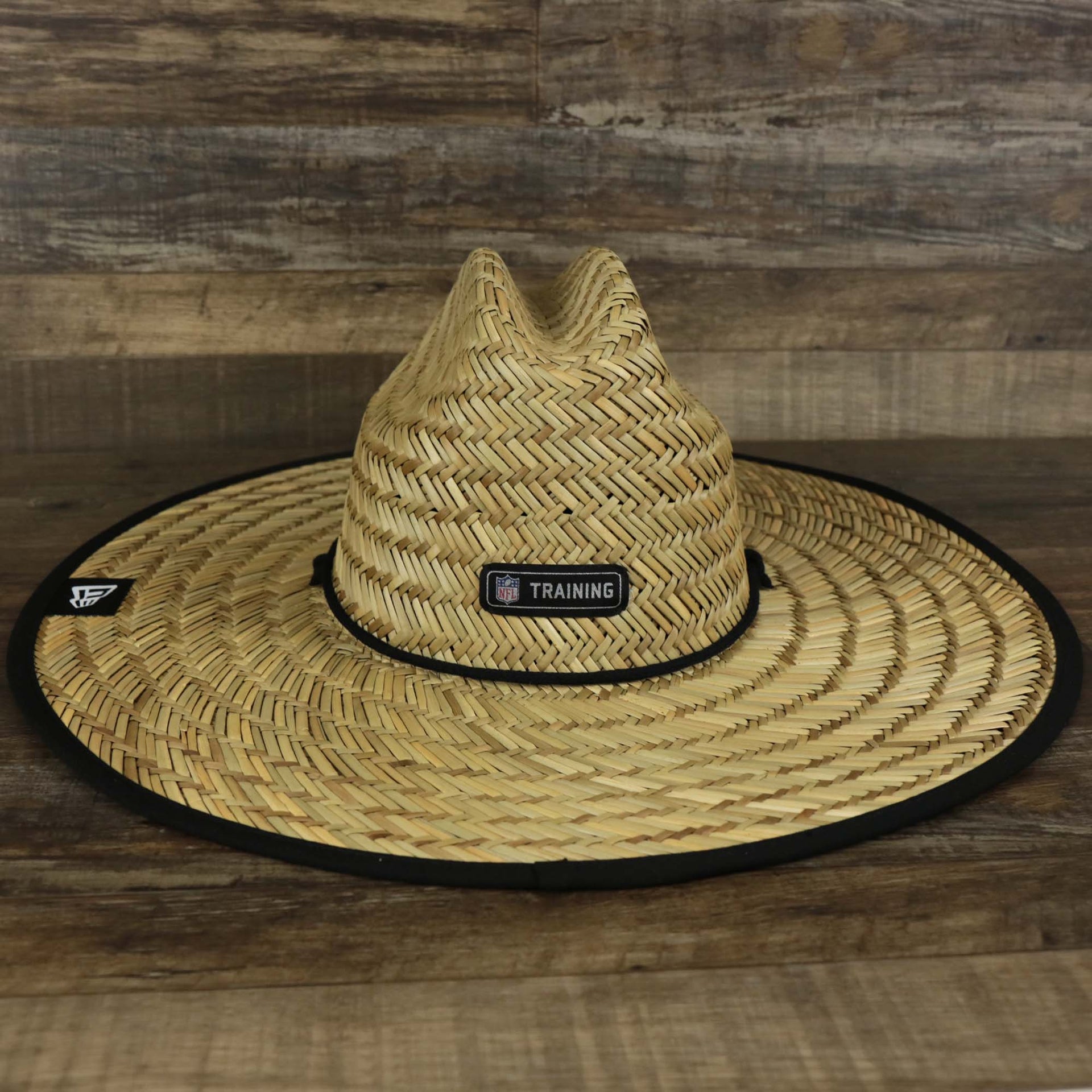 The backside of the Philadelphia Eagles On Field 2022 Summer Training Straw Hat | New Era OSFM