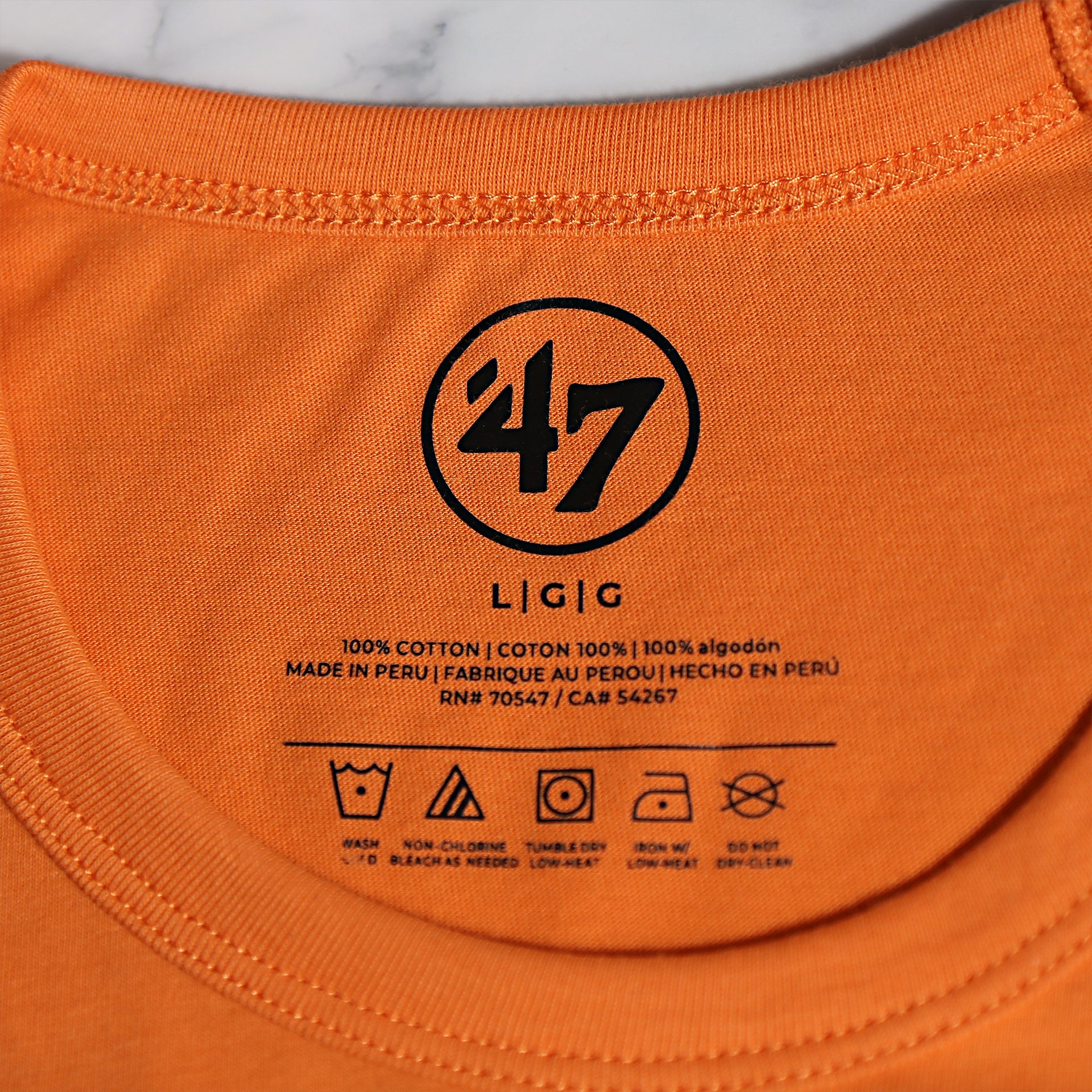 Close up of the neck label on the Philadelphia Flyers Distressed Arch Wordmark Premium Franklin T-Shirt