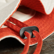 The Chin Strap on the Philadelphia Flyers Logo Orange Undervisor Bucket Hat | Natural Bucket Hat