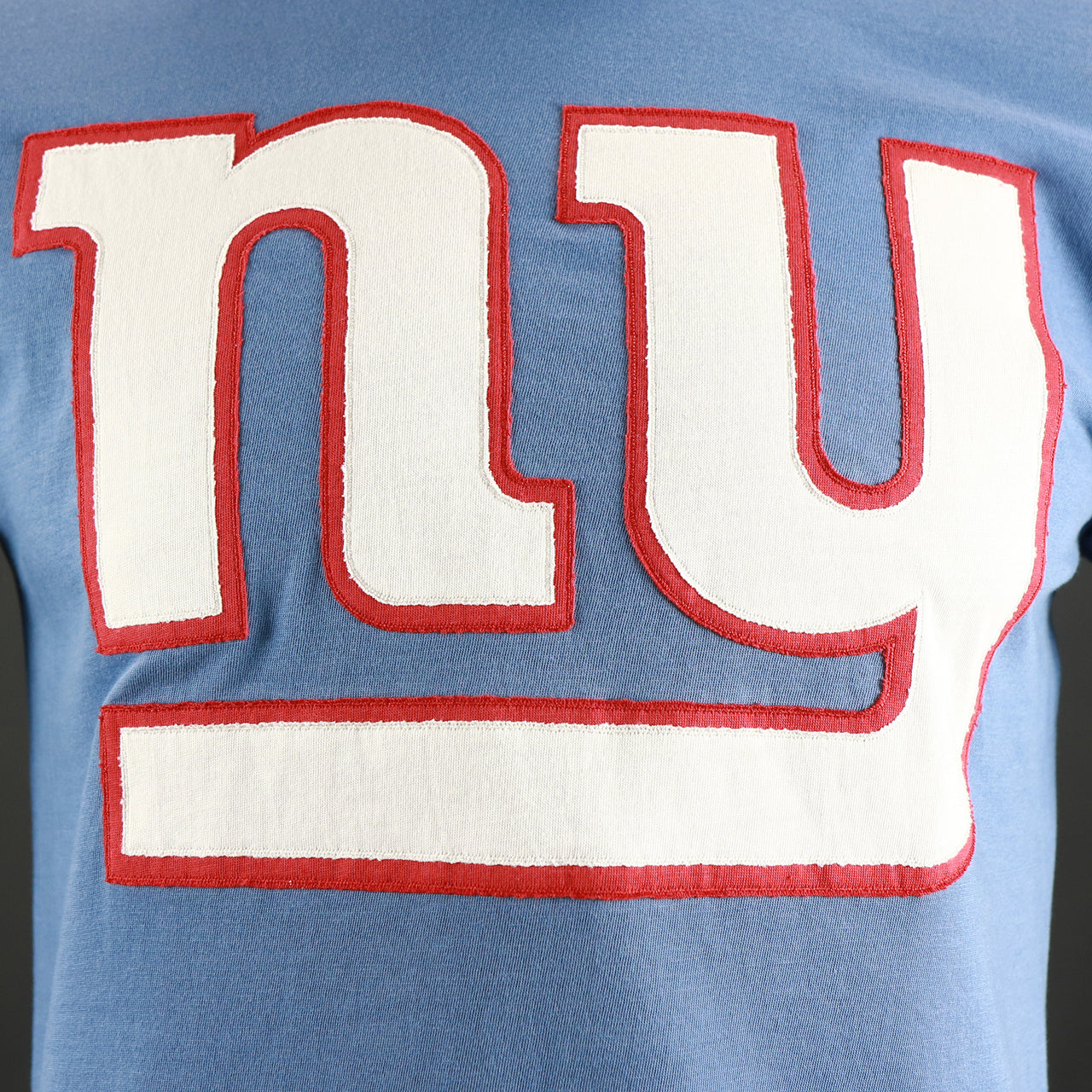 The Giants Logo on the New York Giants Franklin Fieldhouse Embroidered Giants Logo Tshirt | Cadet Blue Tshirt