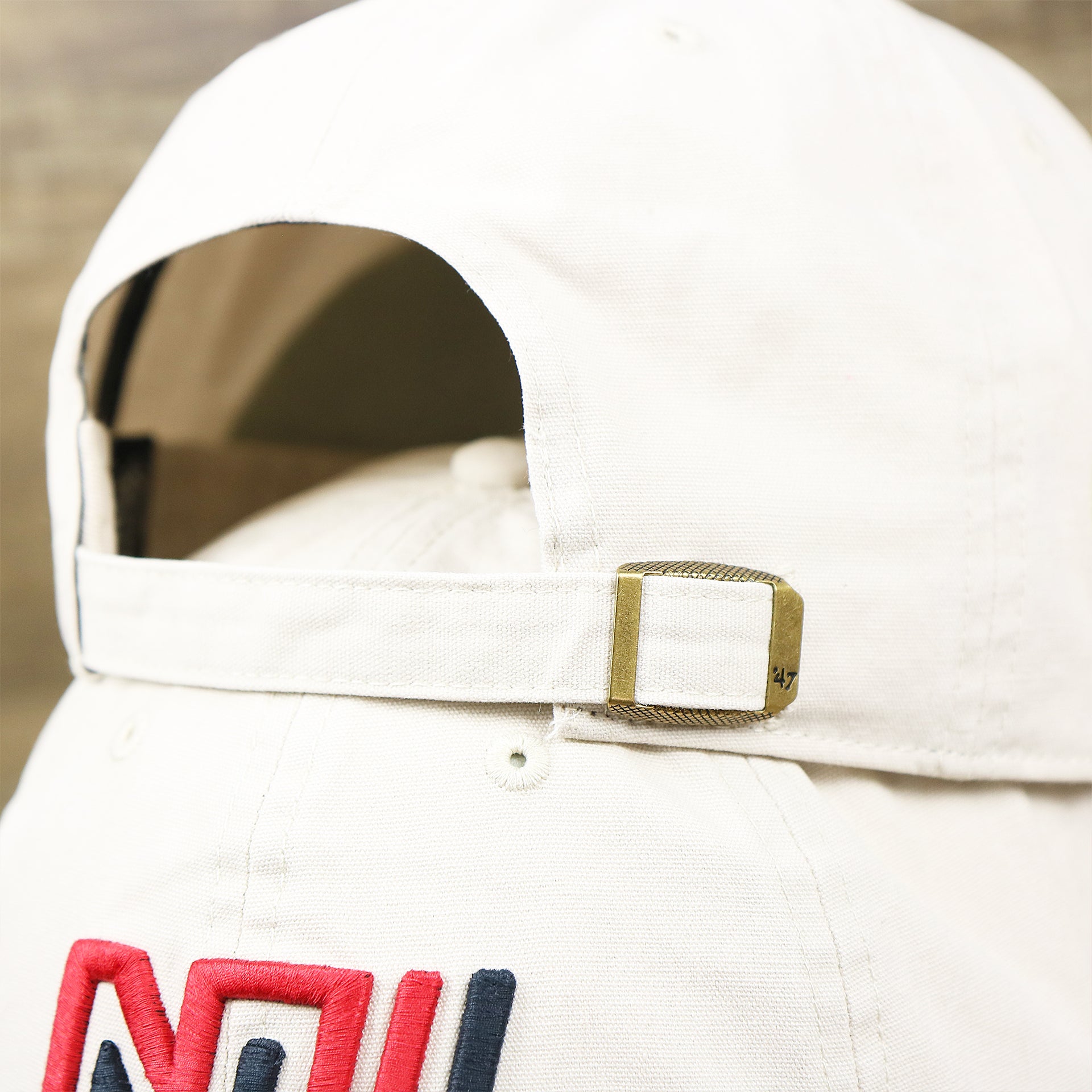 The White Adjustable Strap on the Throwback New York Giants Embroidered 1975 Giants Logo NFL Giants Side Patch Dad Hat | Bone Dad Hat