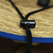 The black adjustable chin strap on the New York Giants On Field 2021/2022 Summer Training Straw Hat | New Era OSFM