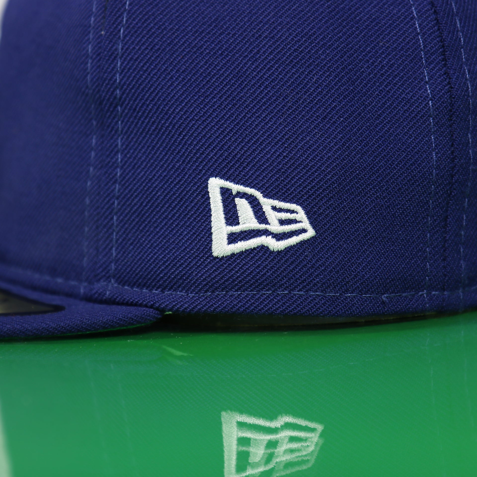 new era logo on the side of the Chicago Cubs Cooperstown Blue 59FIFTY Green Bottom Fitted Cap | Blue