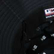 A close up of the removeable chin strap on the New York Yankees MLB 2022 Spring Training Onfield Bucket Hat