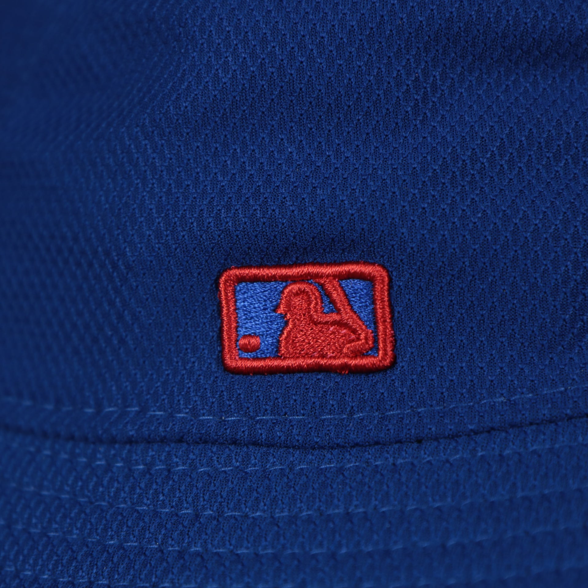 A close up of the MLB Batterman logo on the Chicago Cubs MLB 2022 Spring Training Onfield Bucket Hat