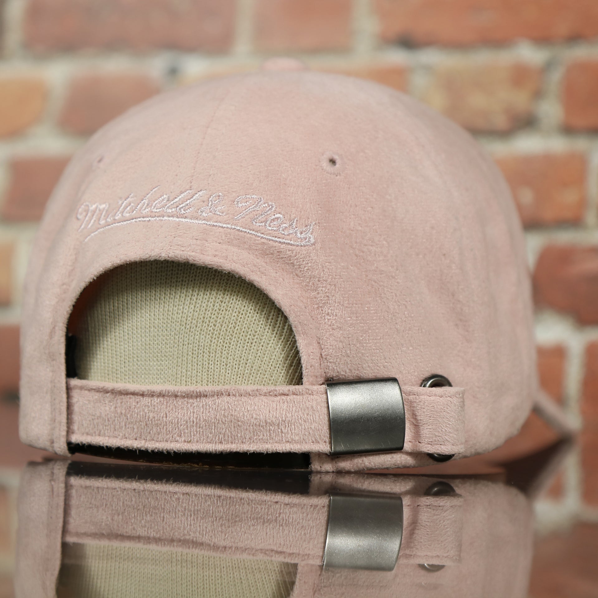 adjustable strap on the Cleveland Cavaliers Micro Suede Pink Dad Hat