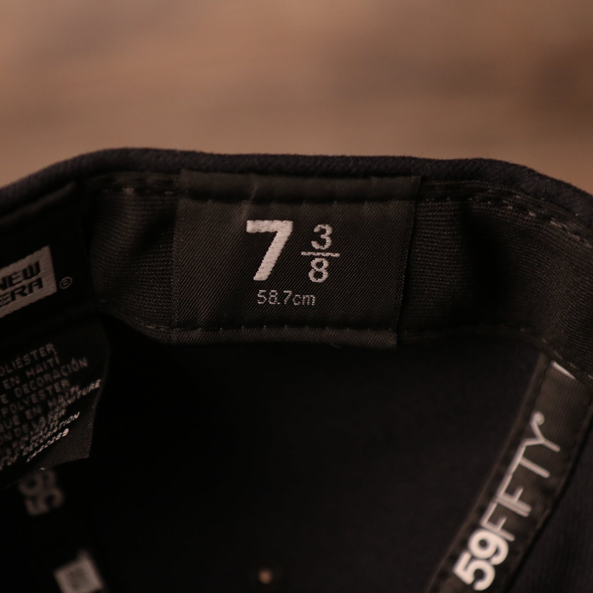 the size tag is also on the inside of this cap Yankees Black Bottom Fitted Cap | New York Yankees On-Field Black Underbrim Fitted Hat