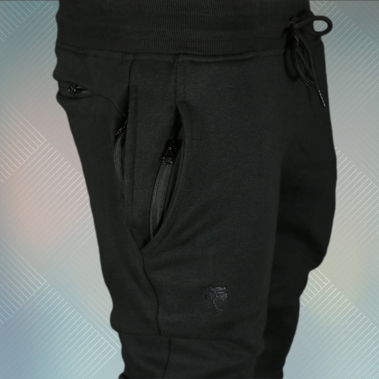 wearers right of the Jet Black Unbasic Fleece Stash Pocket Sunset Park Tapered Jogger Pants | Fleece Black Sweatpants