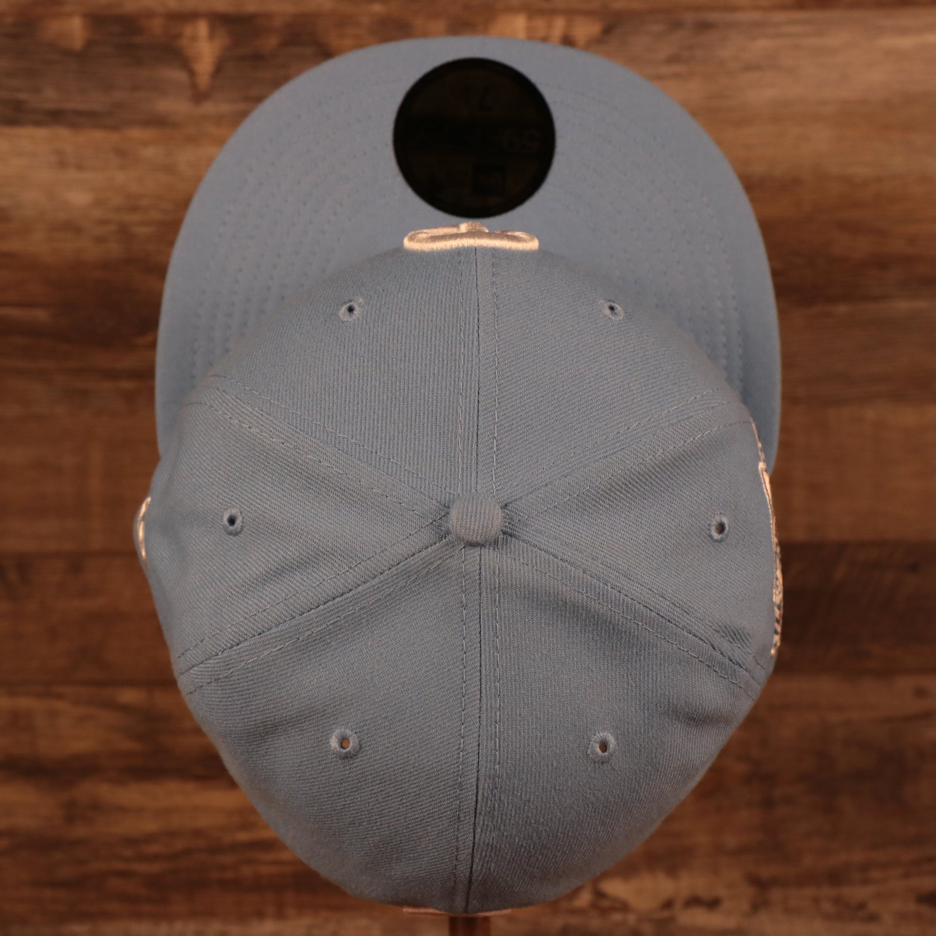 Top down view of the Philadelphia Phillies 1996 All Star Game Icy Blue Pink Bottom Side Patch 59Fifty Fitted Cap