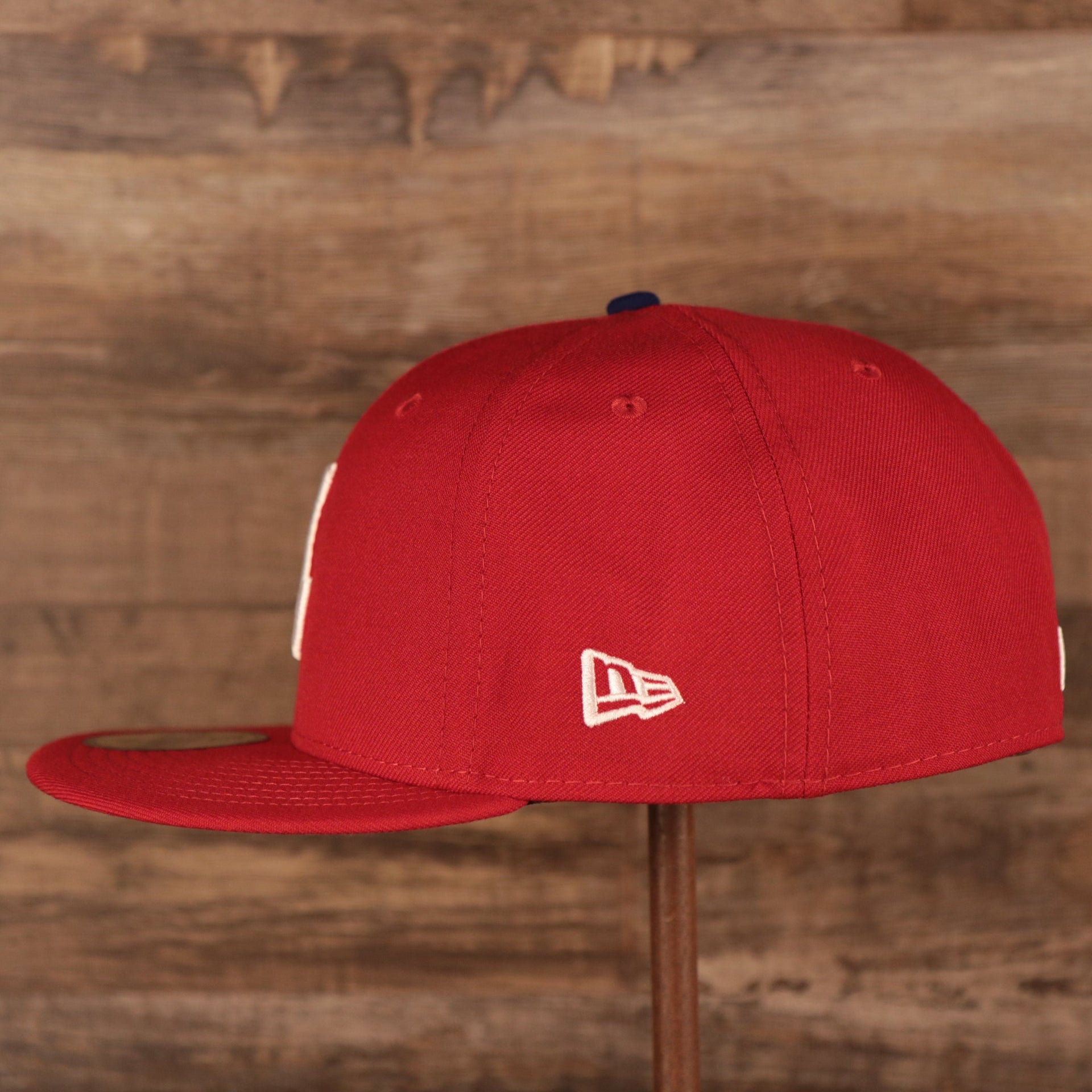 Wearer's left of the Philadelphia Phillies Upside Down Logo Gray Bottom 59Fifty Fitted Cap
