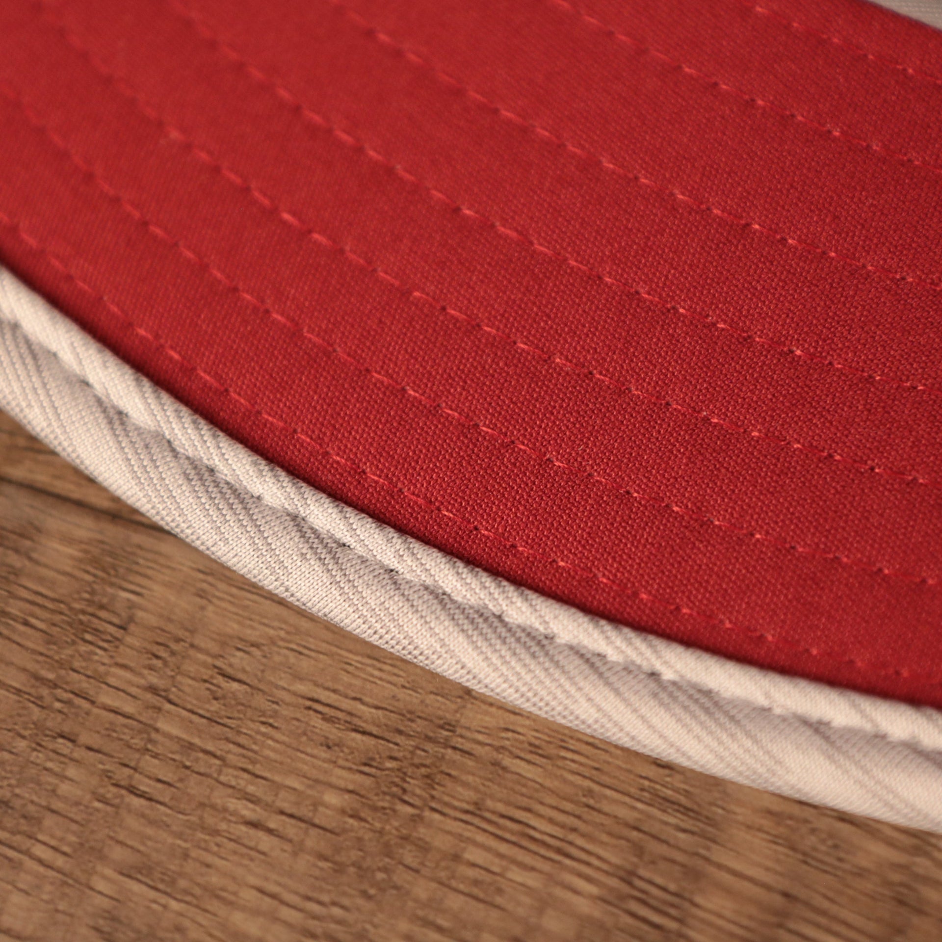 A closeup shot underbrim of the gray 2021 nfl on field arizona cardinals training camp by New Era.