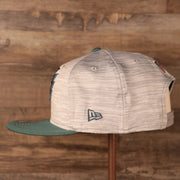 The New Era patch on the side of the 2021 nfl on field snapback hat.