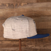 A sideview shot of the snapback hat of the new era training 2021 gray.