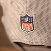 A closeup shot of the NFL patch at the back of the 2021 nfl on field snapback hat.
