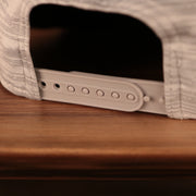 A closeup shot of the back view of the 2021 nfl on field snapback hat.