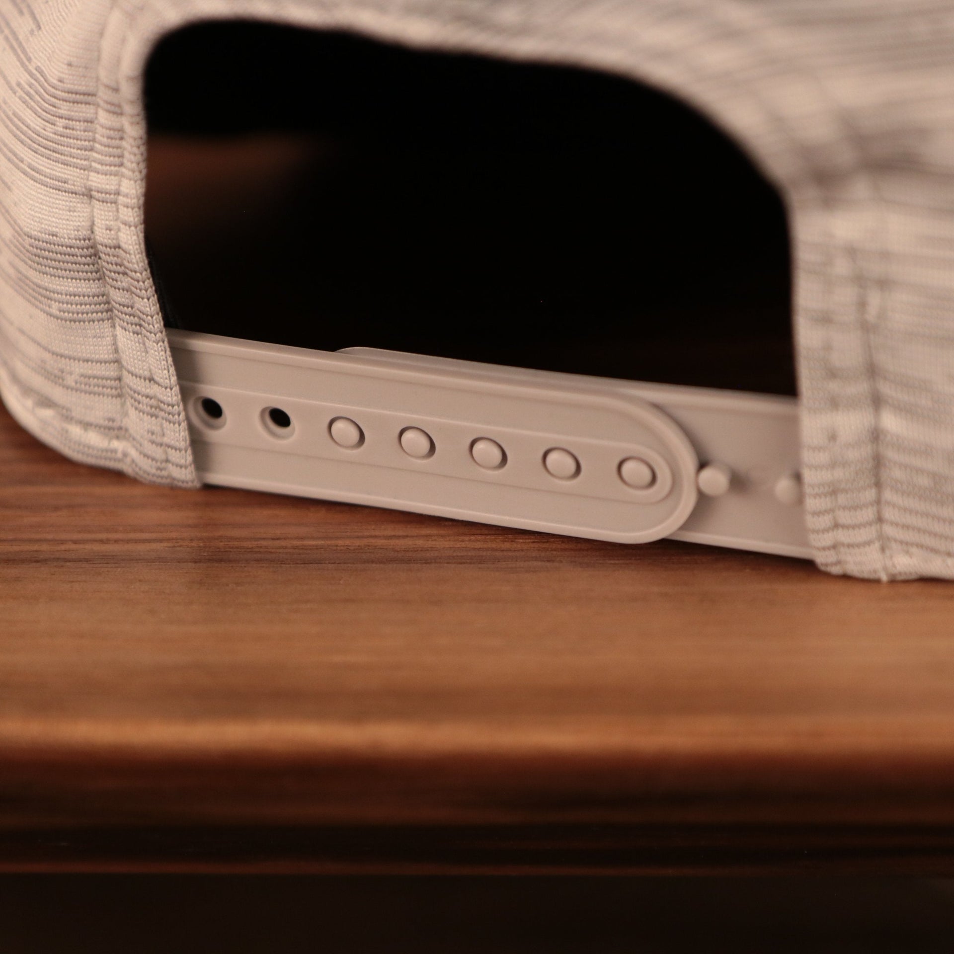 A closeup shot of the back view of the 2021 nfl on field snapback hat.