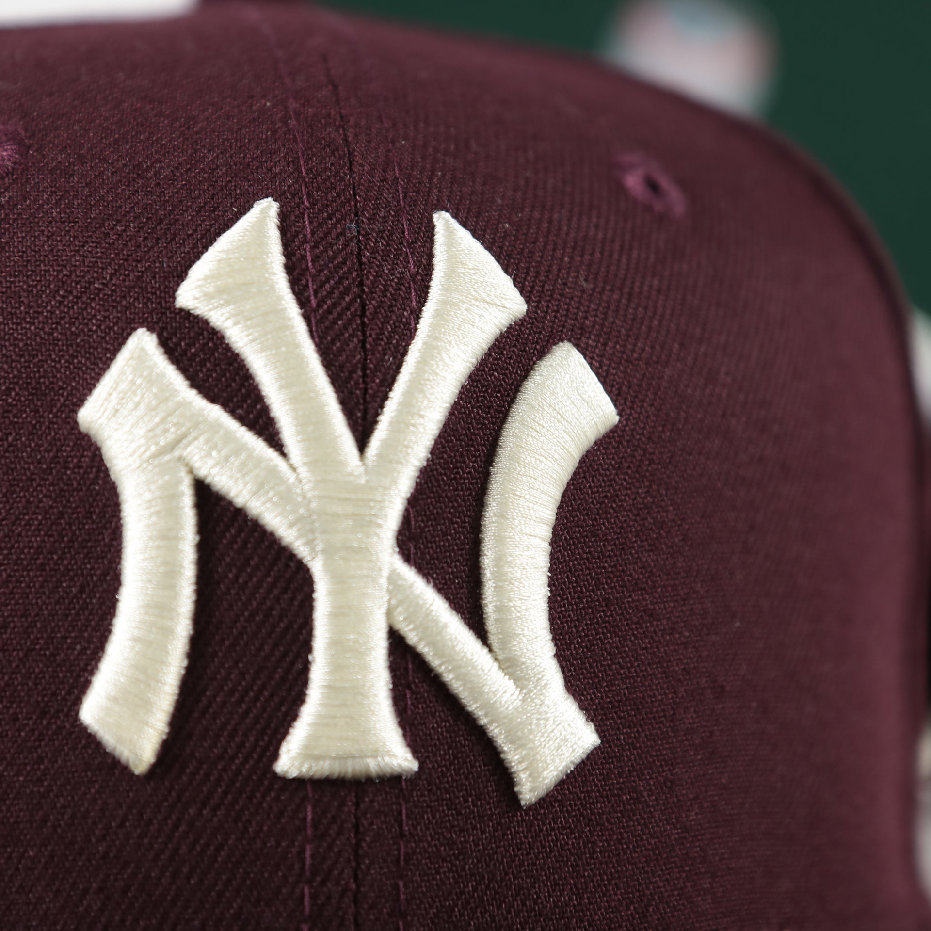 Close up of the logo on the New York Yankees Cooperstown 50th Year Side Patch Dark Green UV 59Fifty Fitted Cap | Vintage Christmas Movie Pack