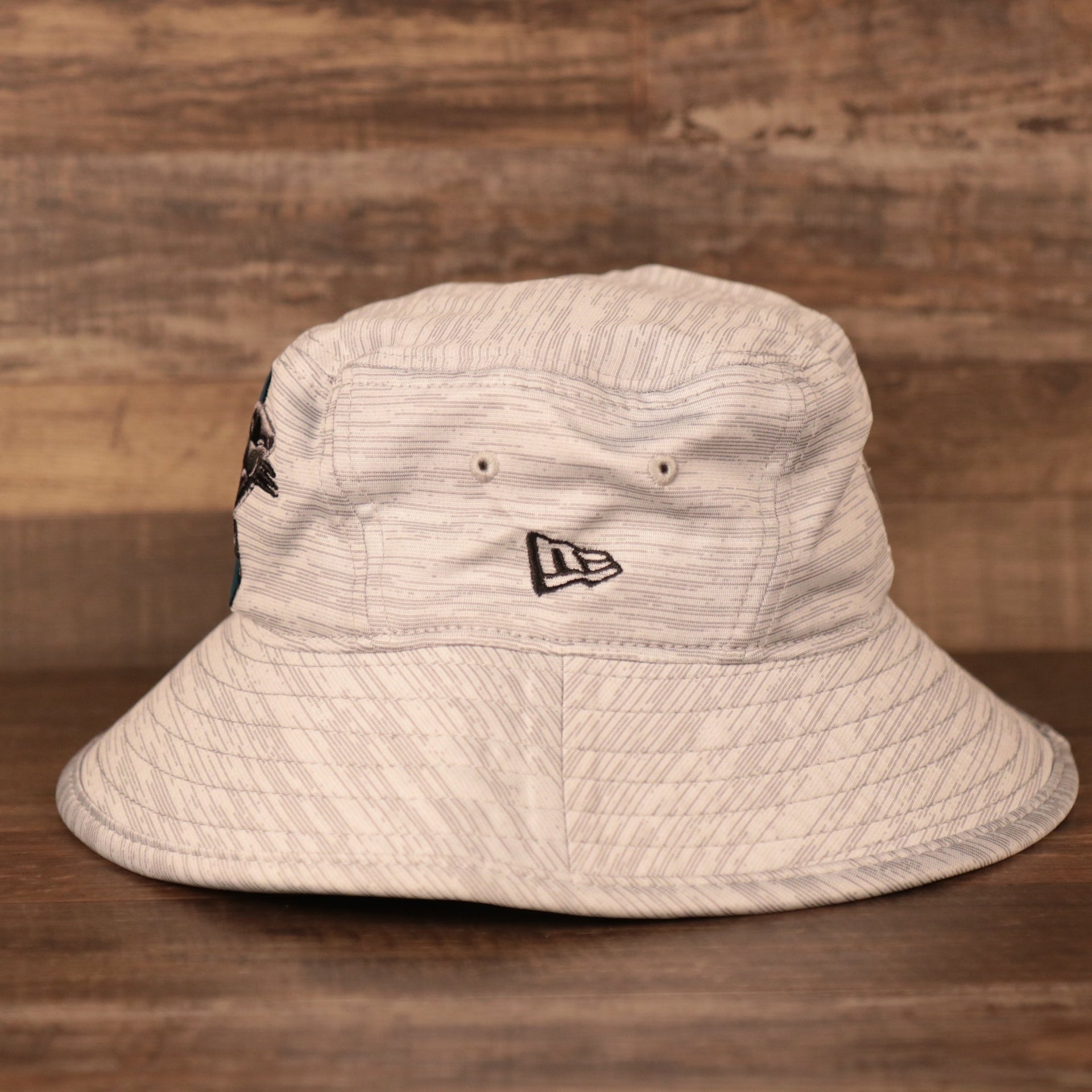 The New Era patch on the side of the carolina panthers nfl training hats bucket hat.