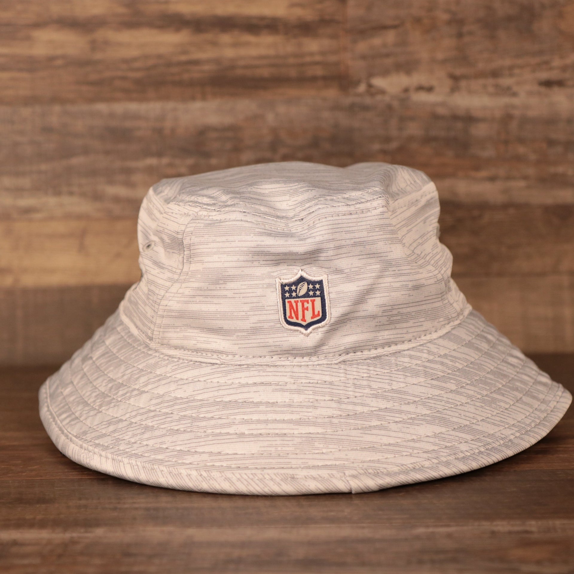 The NFL logo on the back of gray New Era 2021 carolina panthers nfl on field training bucket hat.