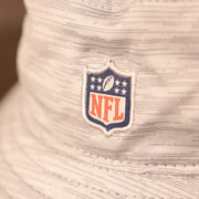 A closeup shot of the NFL patch on the back of the carolina panthers 2021 nfl on field bucket hat.
