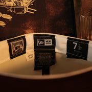 Labels on the interior of the Chicago White Sox Cooperstown 75 Years Side Patch Maroon UV 59Fifty Fitted Cap | Vintage Christmas Movie Pack