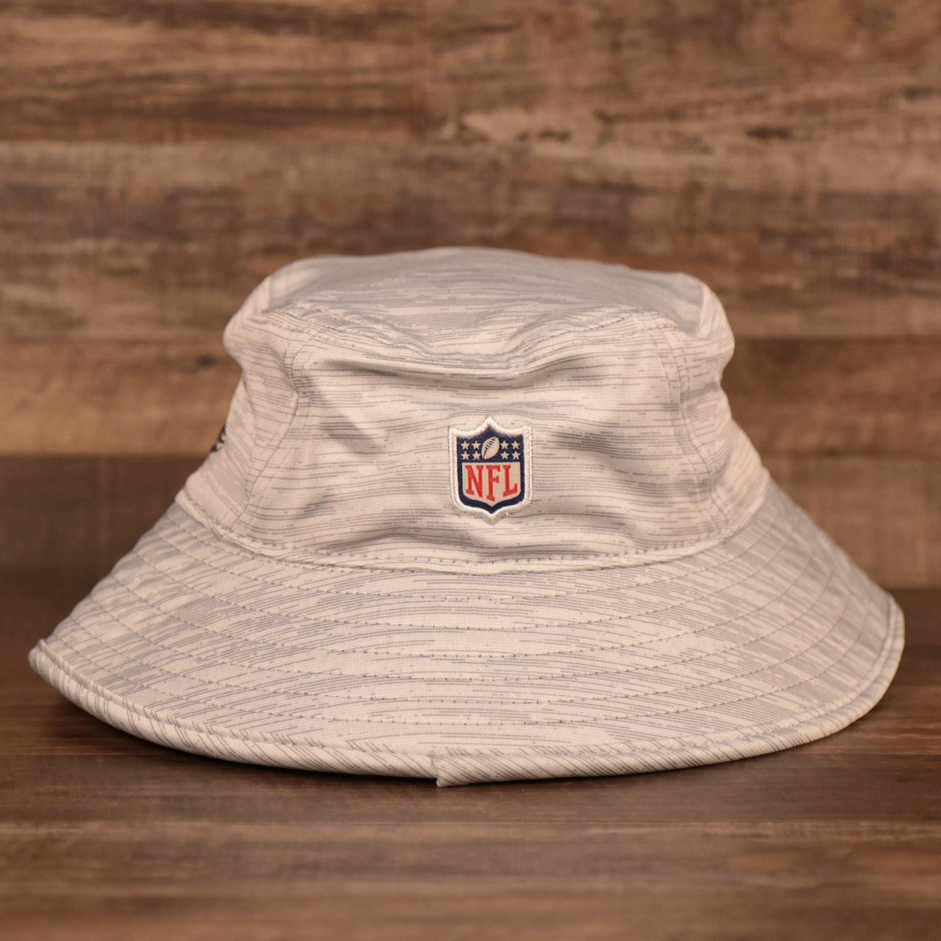 The NFL logo on the back of gray New Era 2021 nfl training atlanta falcons bucket hat.