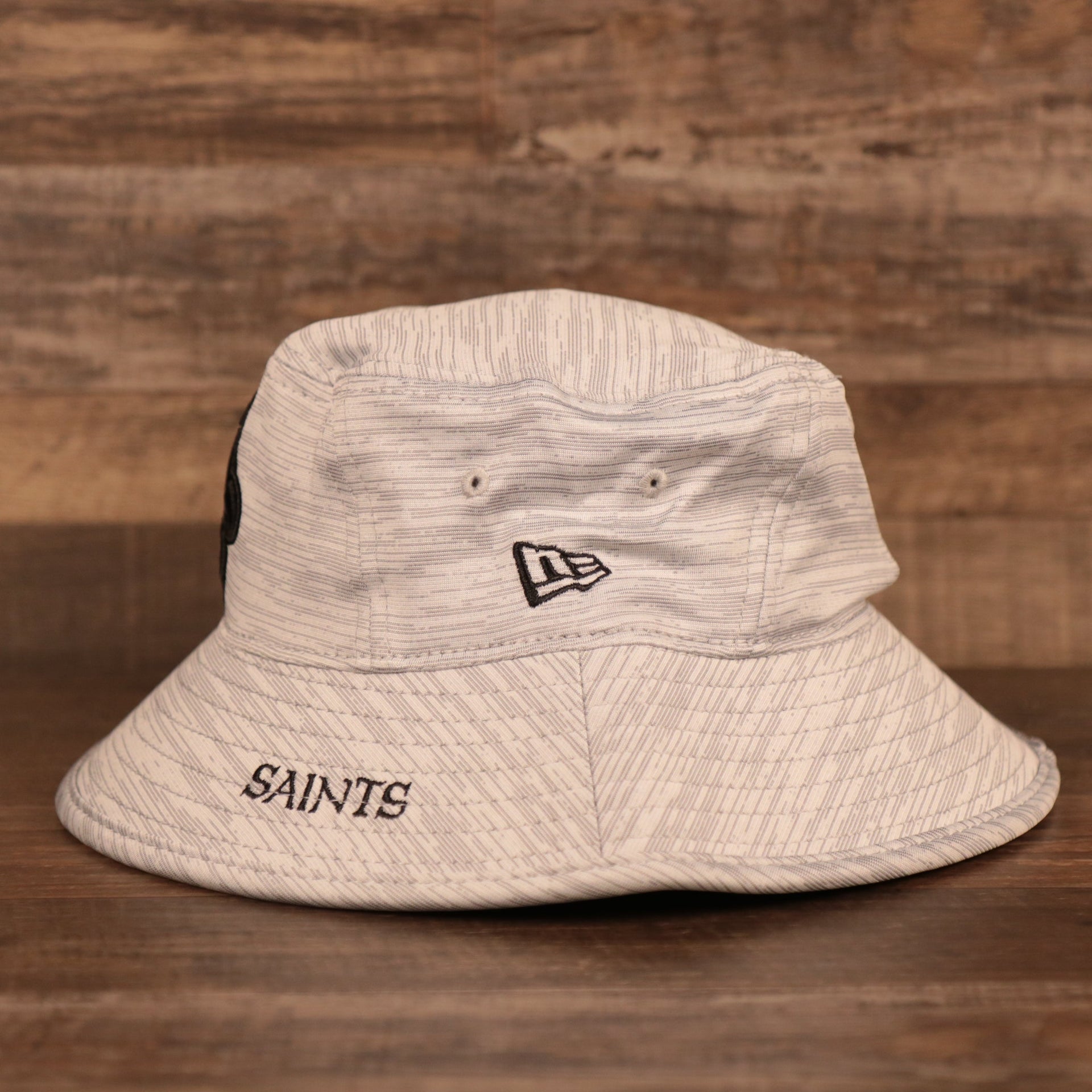 The New Era patch on the side of the nfl training hats bucket hat.