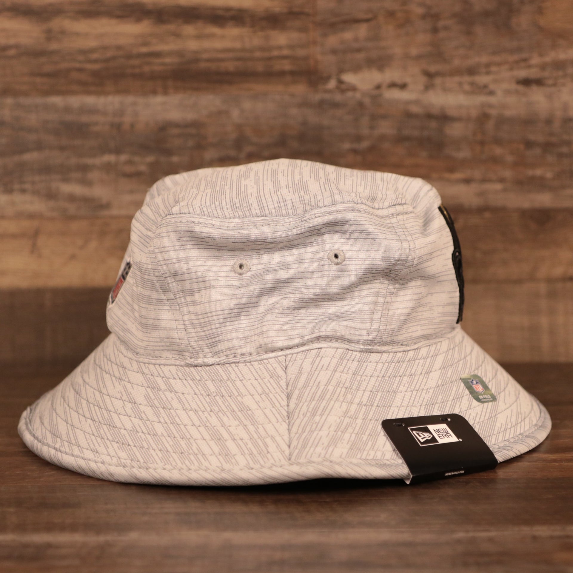 The ventilation holes on the side of the gray 2021 new era training 2021 bucket hat.