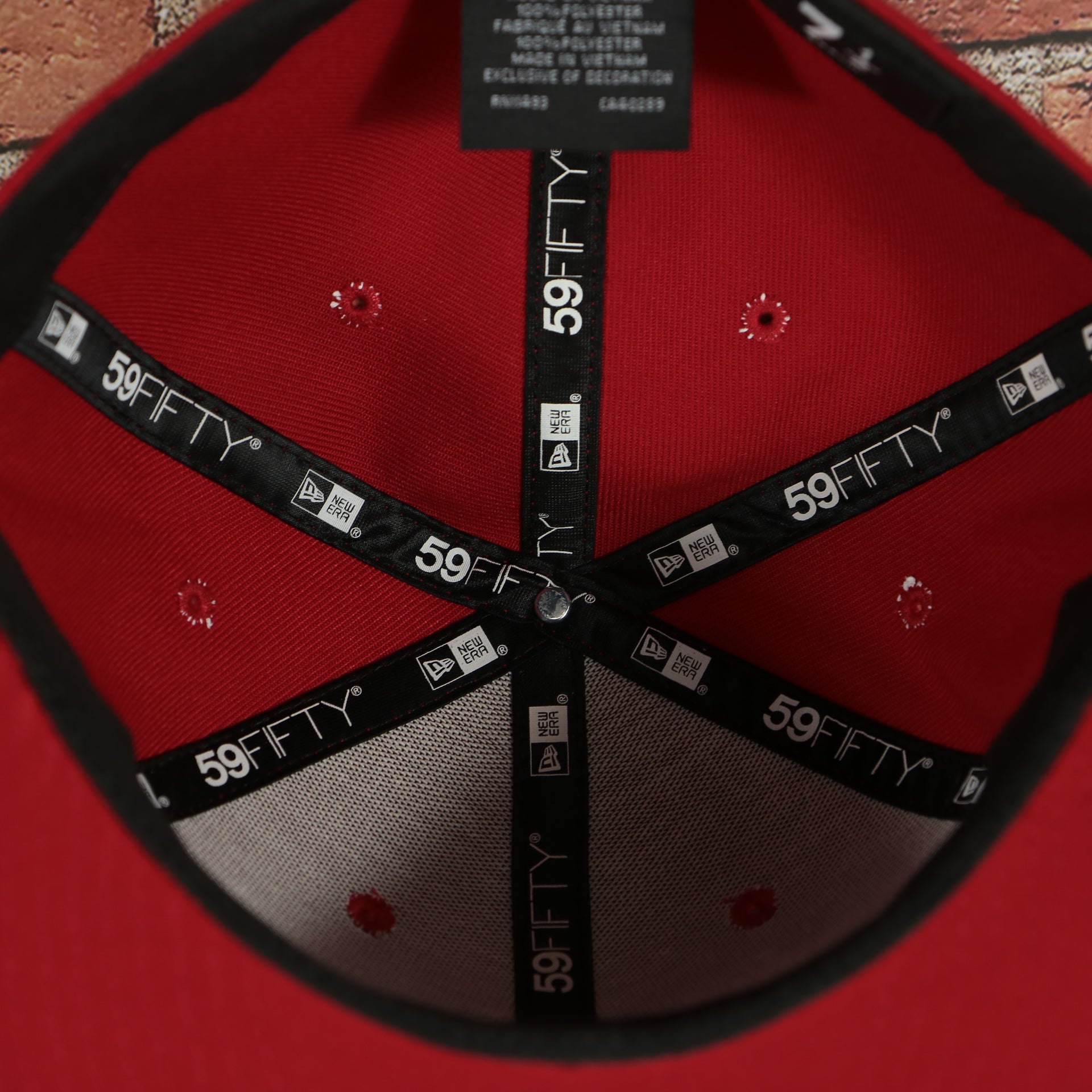 inside taping of the scarlet knights logo on the backside of the Rutgers Scarlet Knights Red Underbrim 59Fifty Fitted Cap | Red Fitted Cap