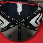 inside taping on the inside of the Houston Rockets 2022 City Edition Retro Houston Red Bottom Youth 9Fifty Side Patch Snapback Cap | New Era, Navy