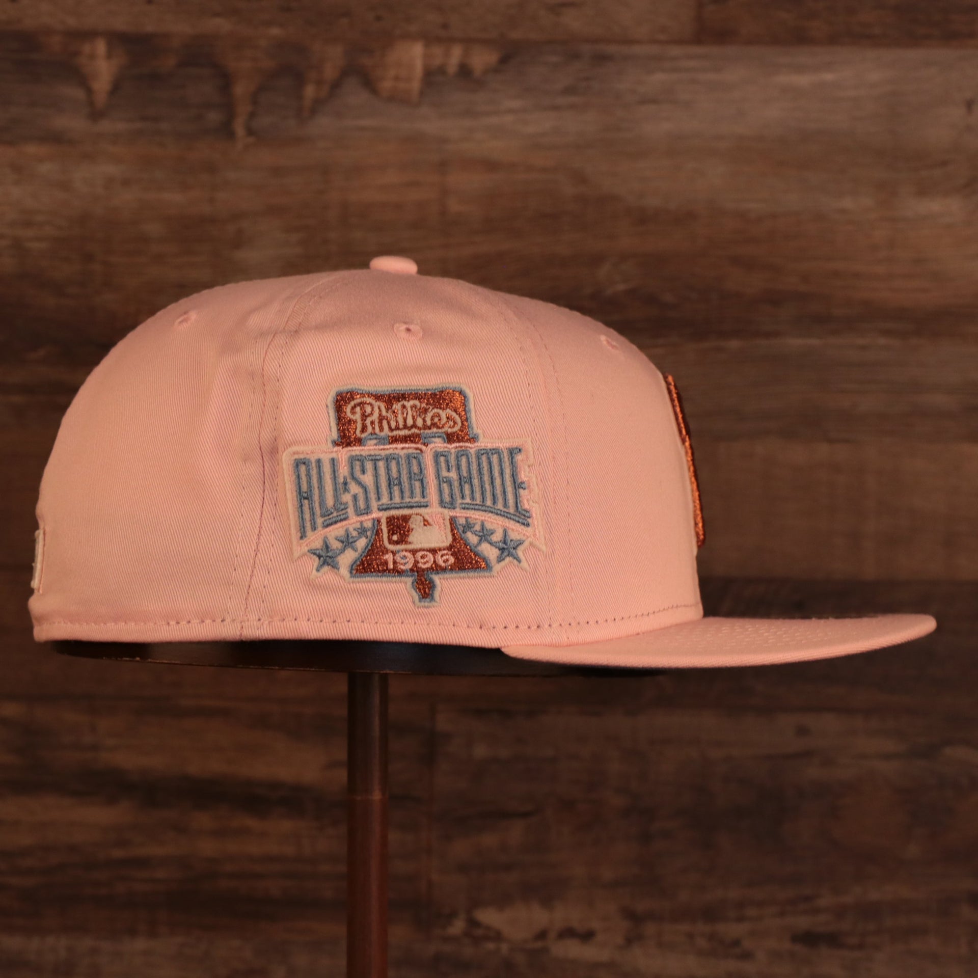 Wearer's right of Philadelphia Phillies Glow In The Dark 1996 All Star Game "il napoletano" Sky Blue Bottom Side Patch 59Fifty Fitted Cap