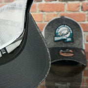 Dark grey under visor of the Philadelphia Eagles 2022 NFC East Division Champions Locker Room Official On Field 9Forty Mesh Trucker Hat