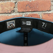 Labels on the interior of the Philadelphia Phillies 2008 World Series Side Patch Cooperstown Pink Bottom 59Fifty Fitted Cap | Sky Blue
