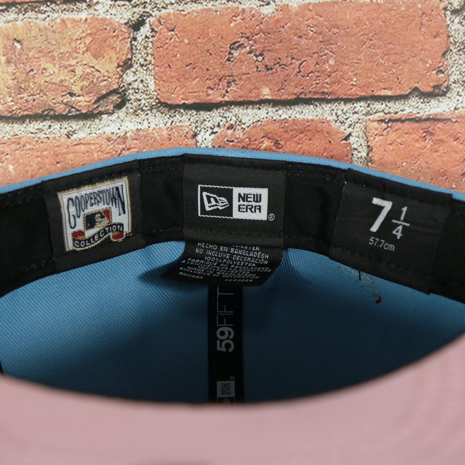 Labels on the interior of the Philadelphia Phillies 2008 World Series Side Patch Cooperstown Pink Bottom 59Fifty Fitted Cap | Sky Blue