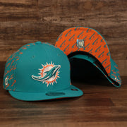 front and bottom of the Miami Dolphins x Gatorade Red 9Fifty Grey Bottom Snapback