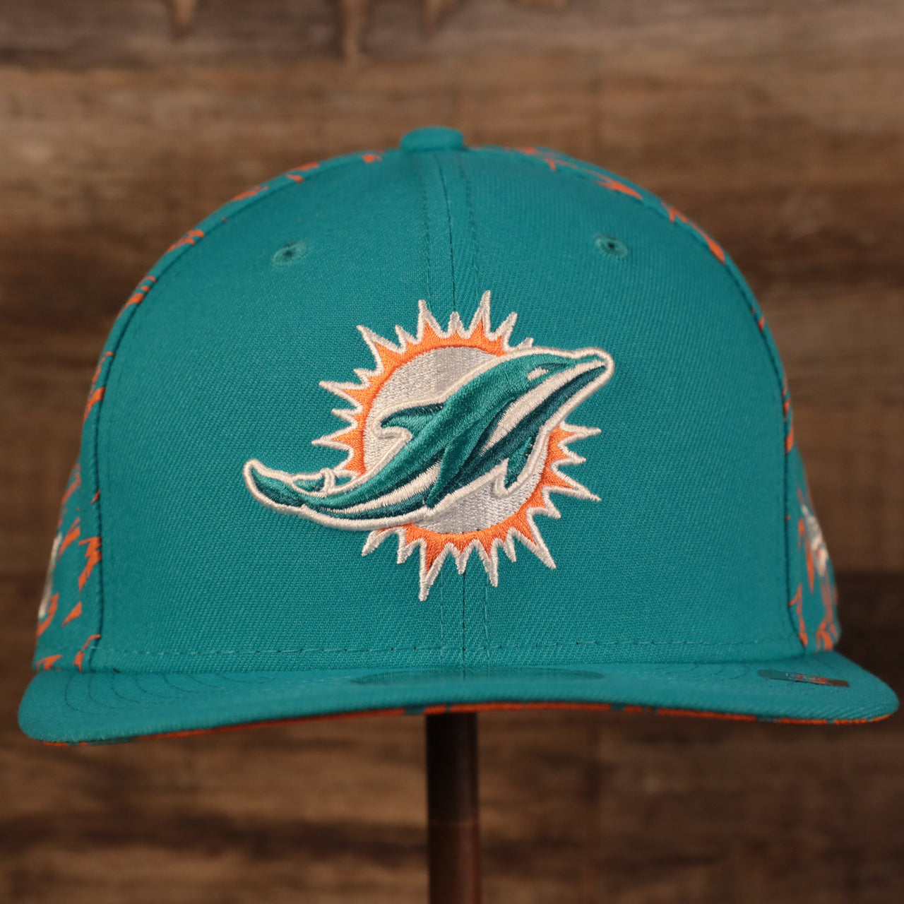 front of the Miami Dolphins x Gatorade Red 9Fifty Grey Bottom Snapback