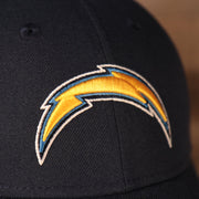 Close up of the Los Angeles Chargers logo on the Los Angeles Chargers The League 940 9Forty Adjustable Dad Hat