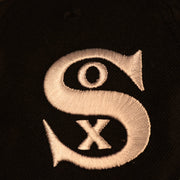 Close up of the White Sox logo on the Chicago White Sox "Pride Patch" All Over Gray Bottom Side Patch 59Fifty Fitted Cap