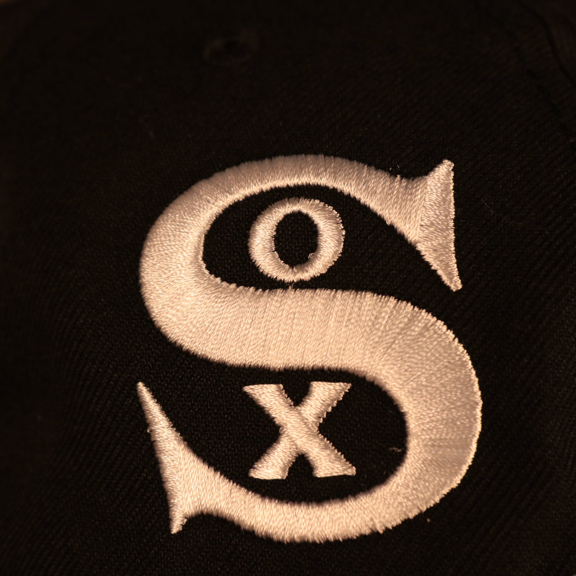 Close up of the White Sox logo on the Chicago White Sox "Pride Patch" All Over Gray Bottom Side Patch 59Fifty Fitted Cap